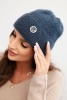 Women's winter fluffy hat with a decorative button denim color