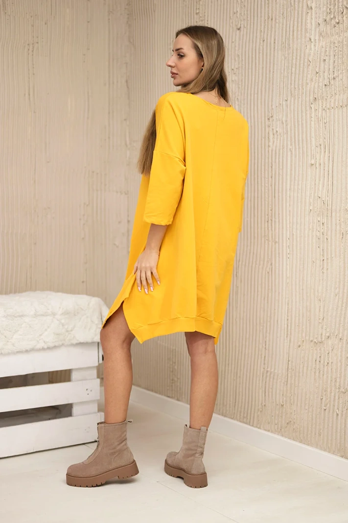 Dress with print and flared bottom mustard