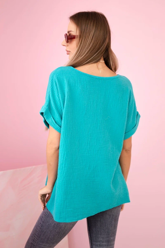 Muslin blouse with a necklace light teal