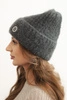 Women's winter hat made of fluffy knit with an elegant button graphite