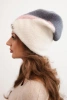 Women's ribbed cap made of modal and viscose with a decorative button ecru