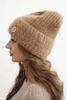 Women's winter hat made of fluffy knit with an elegant button camel