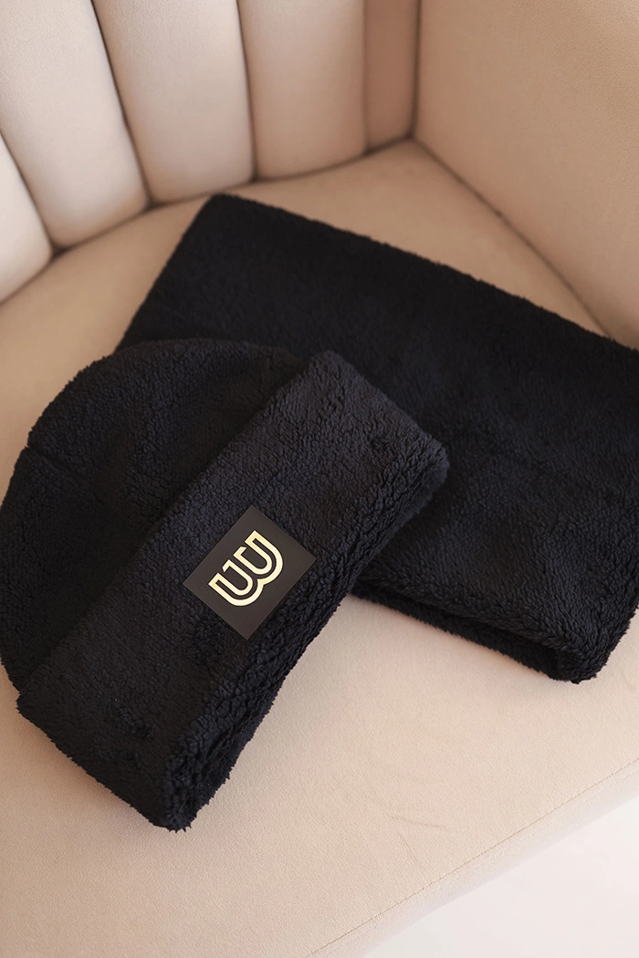 Women's fleece set hat and neck warmer with decorative patch black