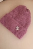 Women's winter fluffy hat with decorative button dark pink