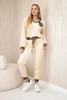 Velour set with a decorative brooch light beige