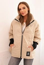 Quilted women's jacket with a short cut and a stand-up collar dark beige