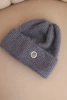 Women's winter fluffy hat with decorative button graphite