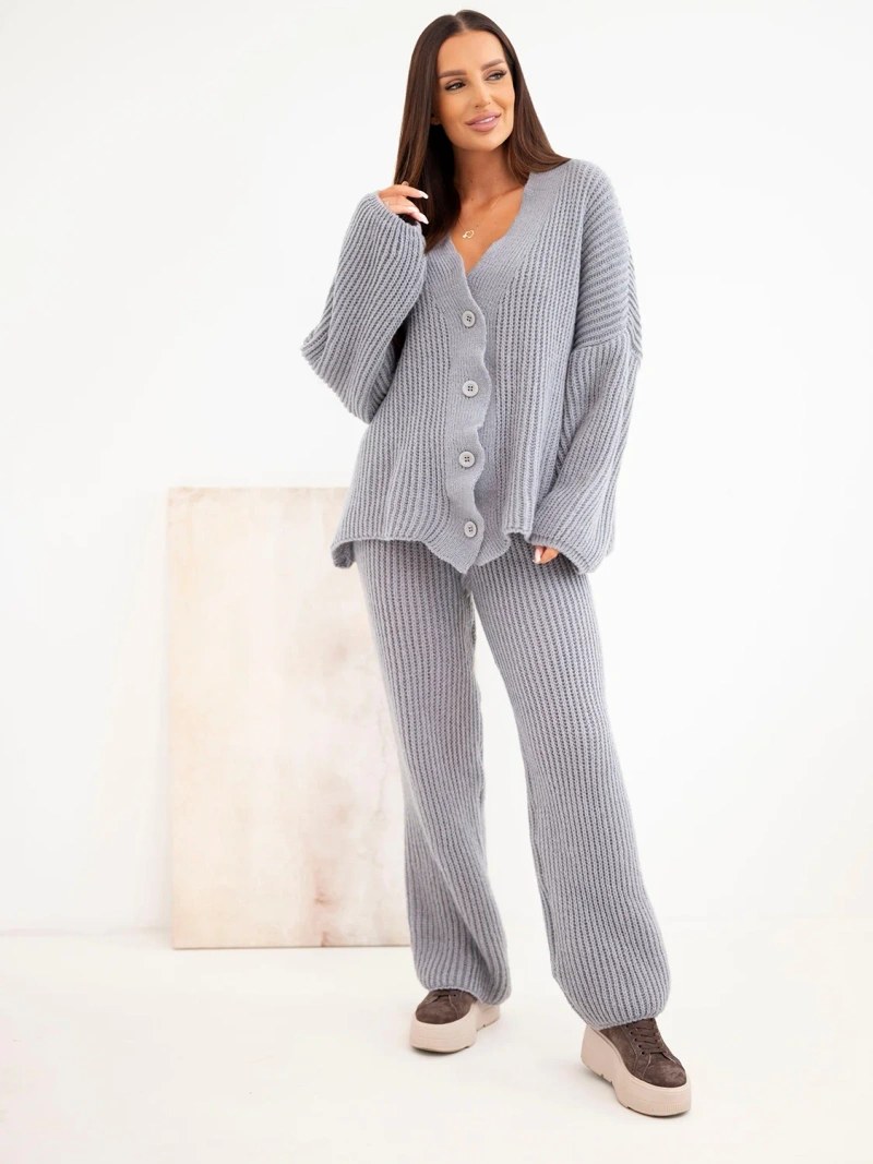 A women's knitted set with a cardigan and wide trousers gray