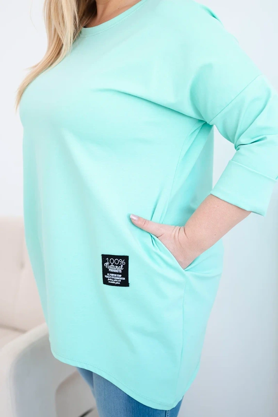 Moteriška bluzonė Plus Size su ilgesne nugarėle ir ilgomis rankovėmis mėtų spalvos