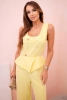 Women's sleeveless jumpsuit with wide leg and decorative buttons yellow