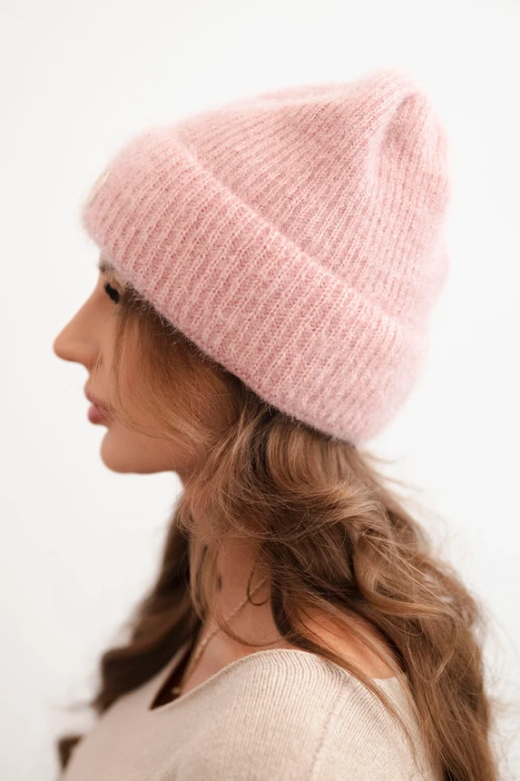 Women's winter fluffy hat with a decorative button light powder pink