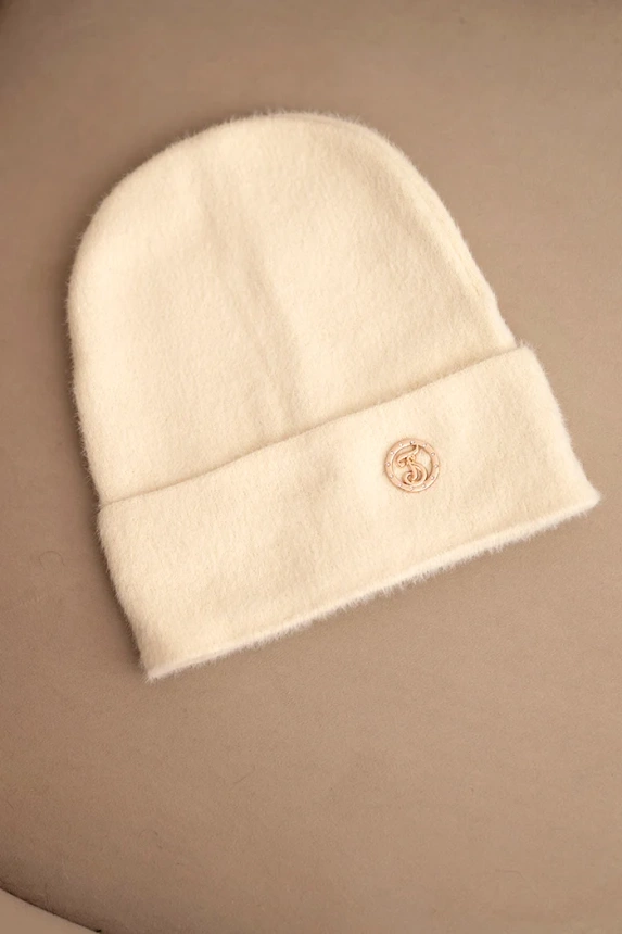 Women's soft alpaca hat with decorative plate beige