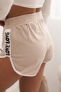 Women's cotton shorts with an elastic waistband and sporty trim beige