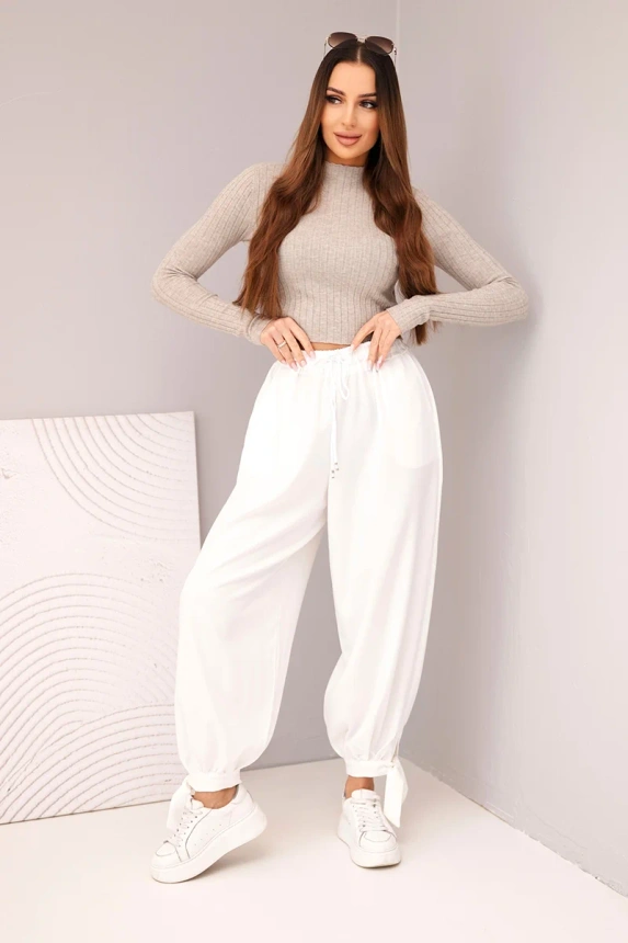 Women’s pants with wide legs and ties at the bottom white