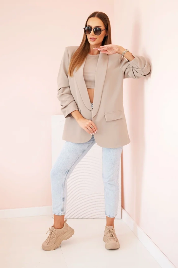 Elegantná bunda s chlopňami tmavo béžová