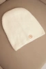 Classic women's alpaca hat with a decorative plate ecru