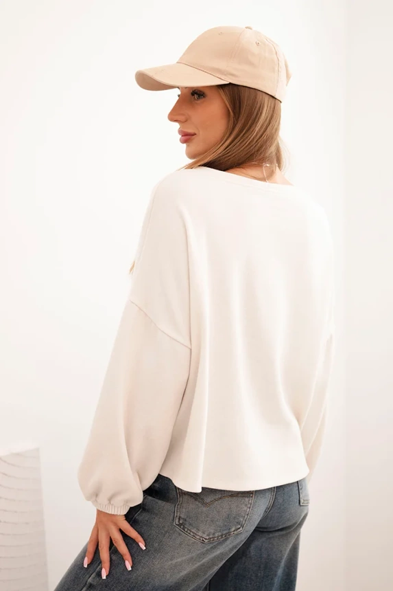 Women's sweatshirt with decorative finishing at the bottom ecru
