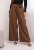 Elegant women's trousers with wide legs and a decorative flower light brown