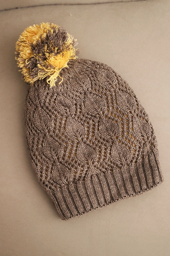 Women's winter hat with wool in decorative knit with pompom K467 mocha
