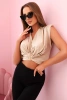 Women's blouse with a deep neckline and a decorative detail beige