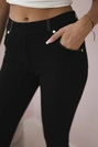 Cotton pants with hem at the pockets black