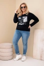 Plus Size women's blouse with a distressed print and longer back black