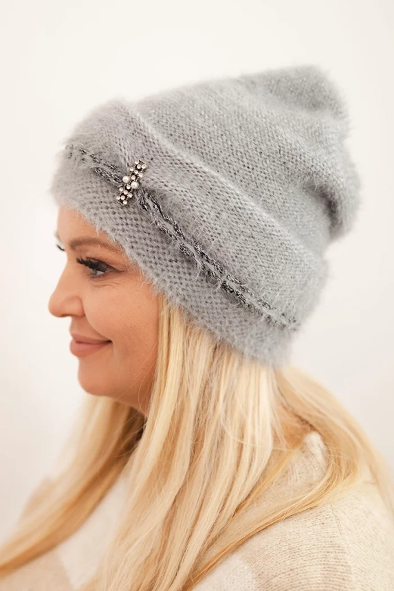 Women's winter fluffy hat with pearls and decorative braid gray