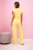 Elegant women's set with wide trousers and a ruffled blouse yellow