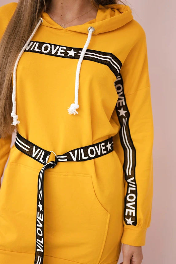 Dress decorated with tape with inscriptions mustard