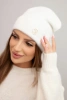 Women's soft hat made of fluffy knit with a decorative plate ecru