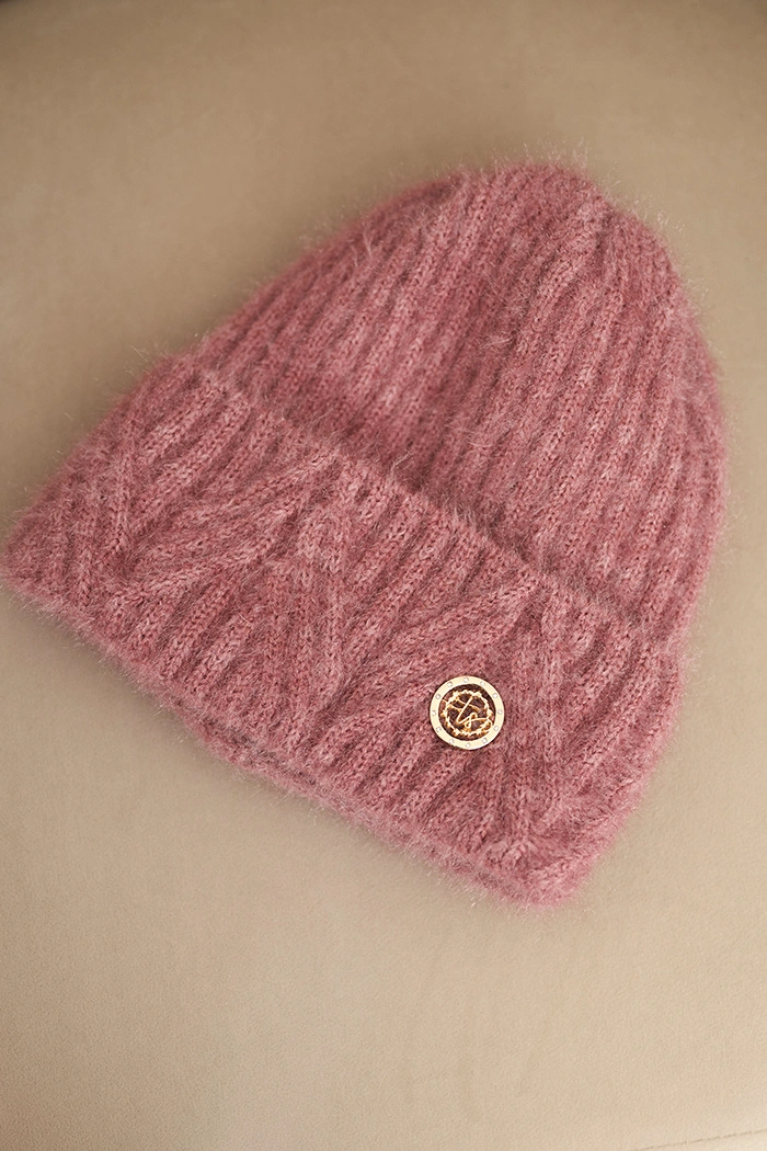 Women's winter hat made of fluffy knit with an elegant button dark pink