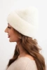 Women's winter fluffy hat with decorative button ecru