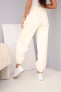 Women's cotton high-waisted trousers with a decorative button melon