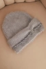 Women's winter fluffy hat with pearls and decorative braid gray