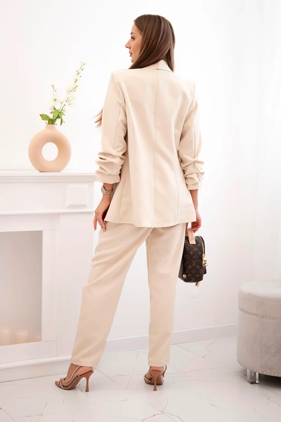 Elegant set of jackets and trousers light beige
