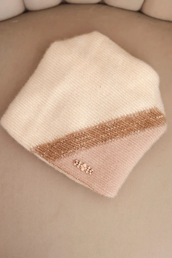 Women's winter hat made of fluffy knit with a decorative appliqué ecru + beige
