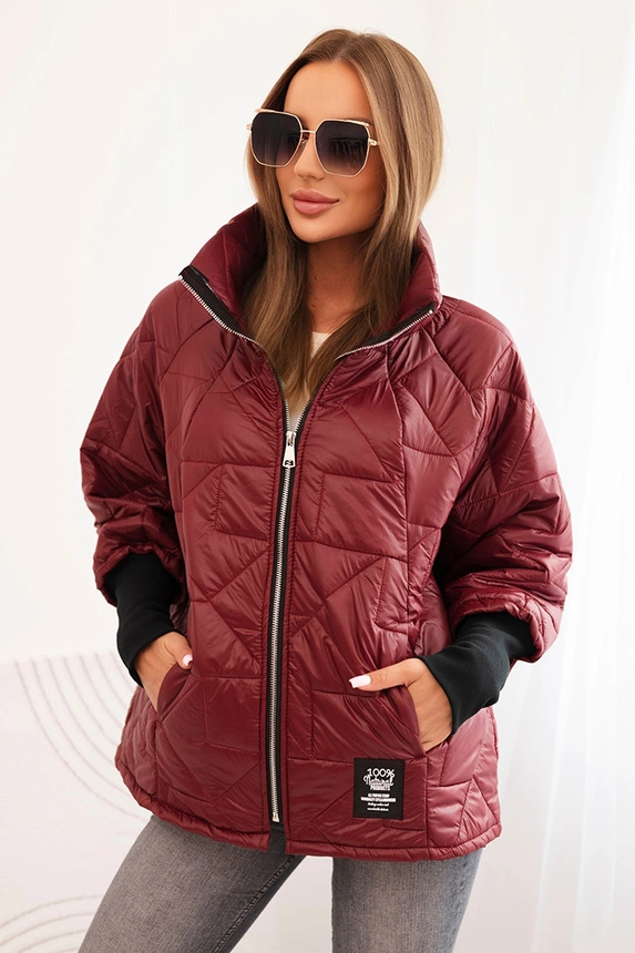 Quilted women's jacket with a short cut and a stand-up collar burgundy