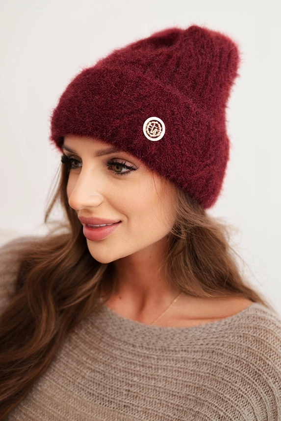Women's winter hat made of fluffy knit with an elegant button burgundy