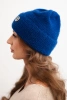 Women's winter fluffy hat with decorative button cornflower blue