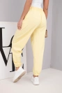 Women's cotton high-waisted pants with decorative button yellow