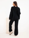 A women's knitted set with a cardigan and wide trousers black