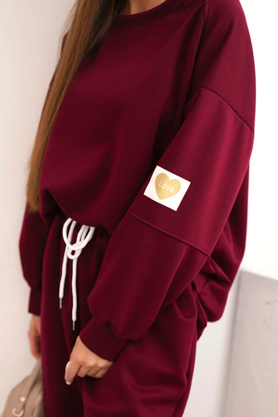 Ladies' butter set with a loose sweatshirt and pants with the inscription LOVE khaki