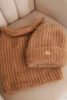 Women's set hat and winter fluffy scarf with decorative emblem camel