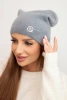 Classic women's cap made of soft knit with a decorative metal plate gray