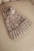 Women's winter hat with a pom-pom made of wool K424 dark beige