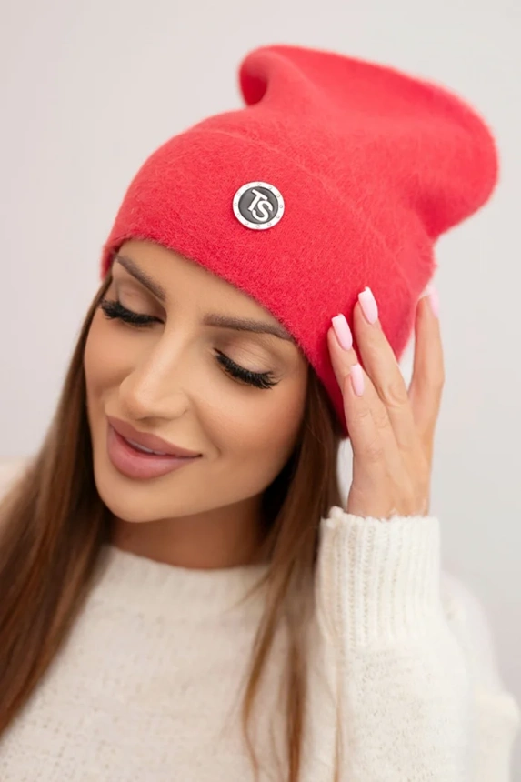 Women's soft hat made of fluffy knit with a decorative plate raspberry