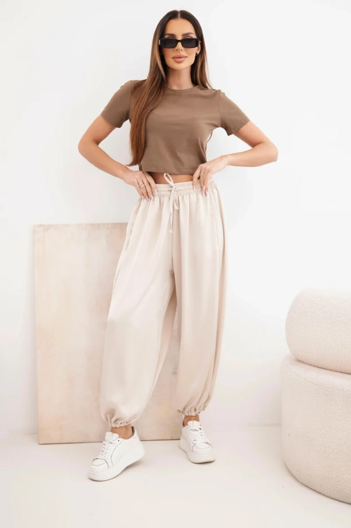 Women's wide trousers with elastic waistband and Aladdin-style drawstring beige