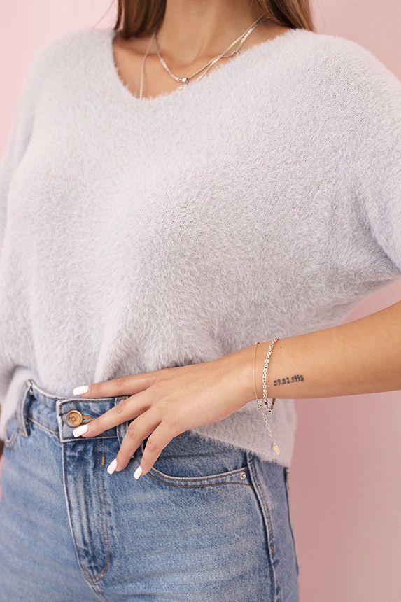Women's sweater made of soft fluff with a V-neck and short sleeves gray