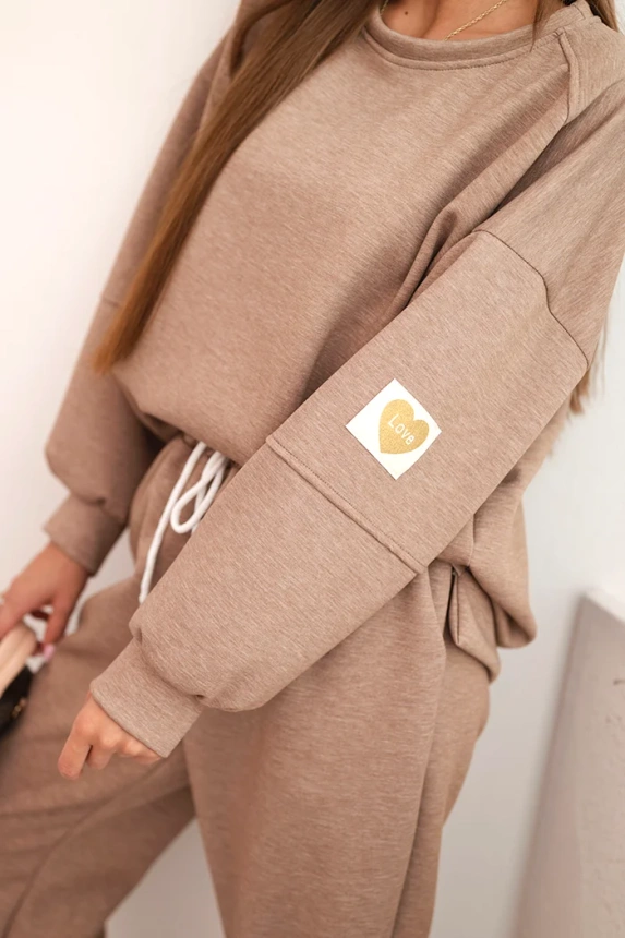 Ladies' butter set with a loose sweatshirt and pants with the inscription LOVE khaki