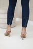 Dark denim trousers with a bow 